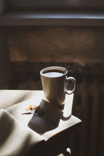 Close-up of coffee cup on table