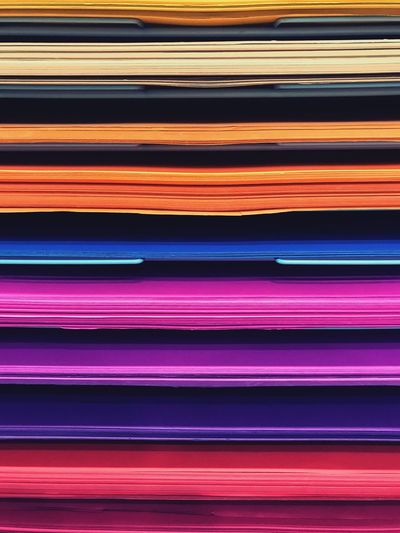 Full frame shot of colorful stacked folders