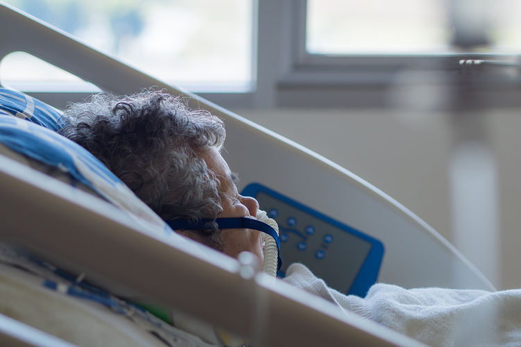 Close-up of elderly woman patients with lung disease, getting oxygen for treatment at hospital