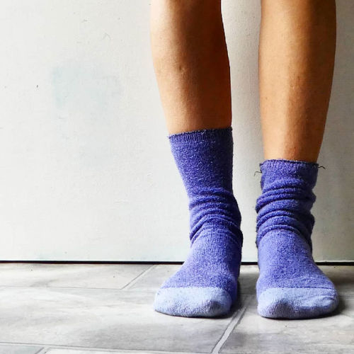 Low section of woman wearing socks