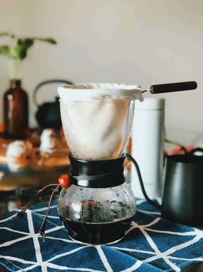 Close-up of coffee dripper on table