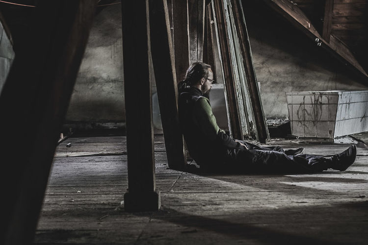 Man sitting in abandoned room