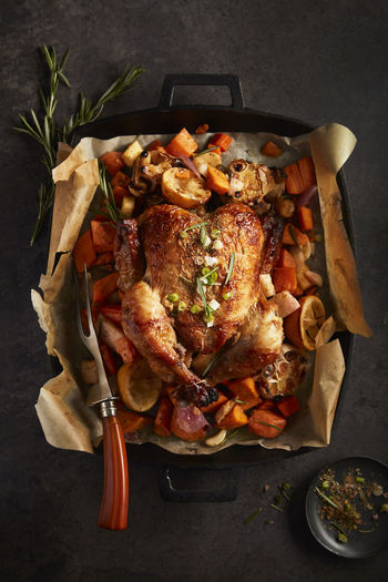 Roasted chicken in sweet potatoes and garlic lemon