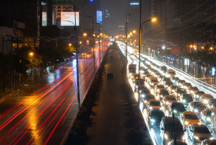 High angle view of light trails on road at night