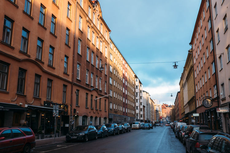 Cars parked on road in city