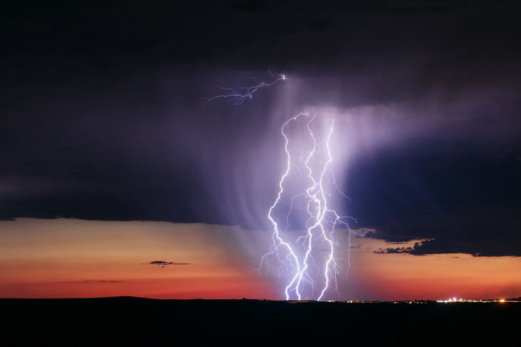 A powerful lightning bolt strikes from a storm near holbrook, arizona.