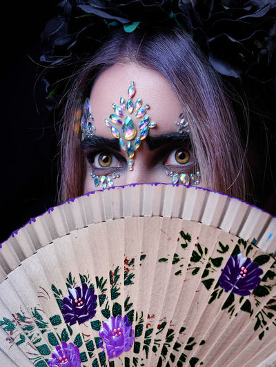 High angle view of young woman wearing mask