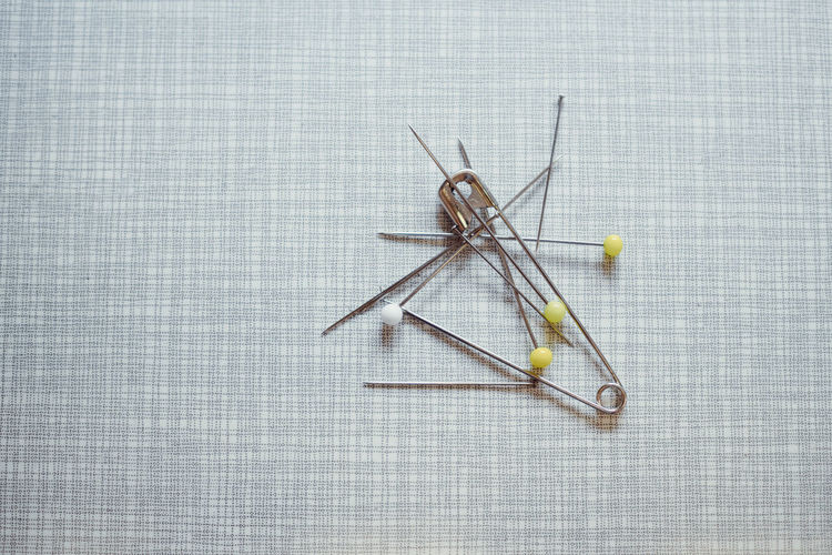High angle view of pins on table