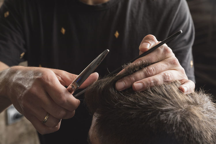 Hairdresser and beautician working in her hair salon