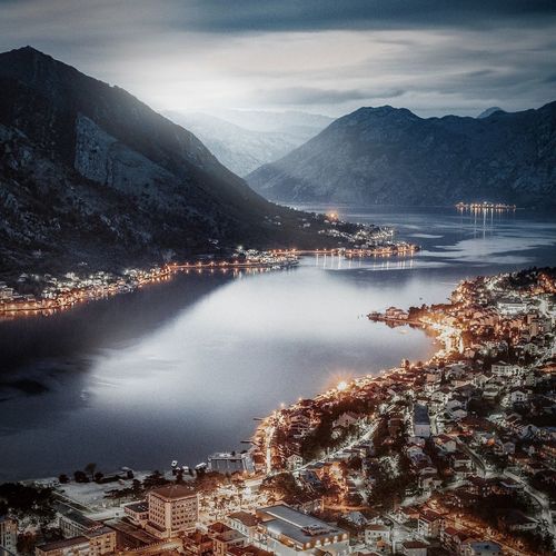 Aerial view of lake and mountains against sky