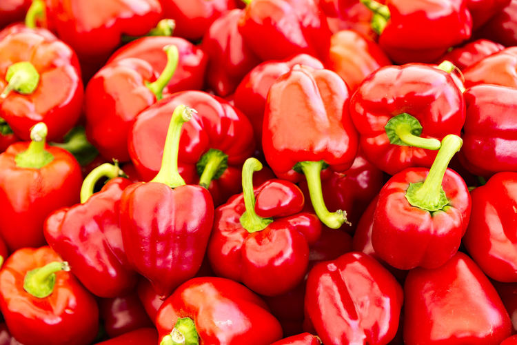 Full frame shot of red bell peppers for sale in market