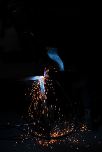 Welder welding in factory