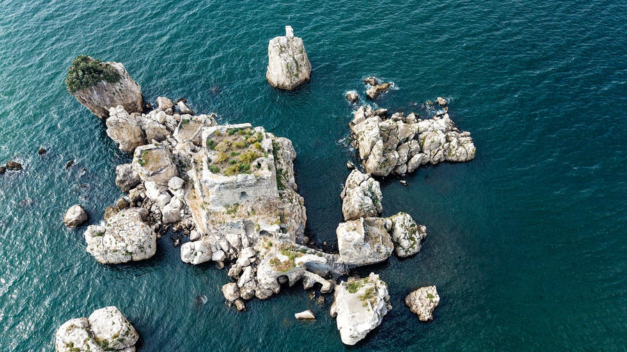 Aerial view of a small island with the remains of a norman tower