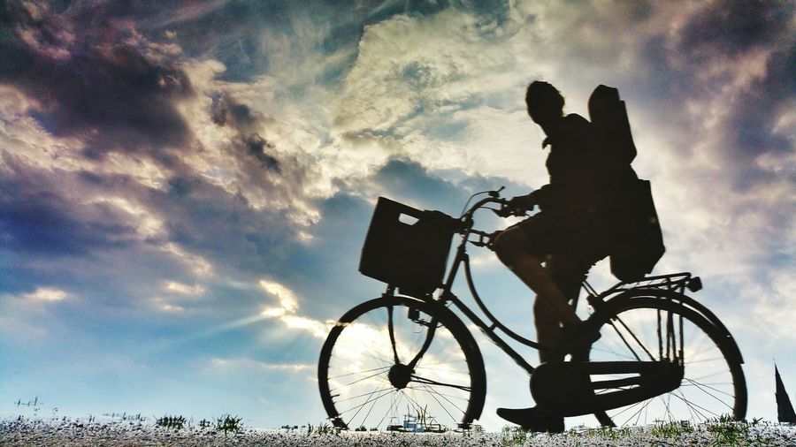 Low angle view of silhouette bicycle against sky during sunset