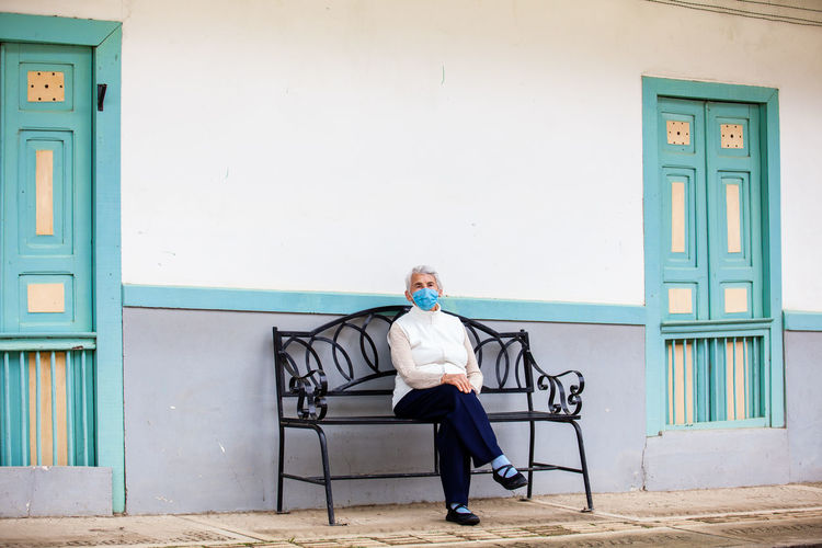 Senior woman traveling at the small town of salento, located on the region of quindio in colombia
