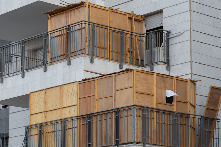 A wooden sukkah inside the balcony of a building, the jewish holiday of sukkot