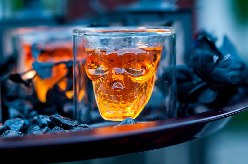 Close-up of whisky served in skull glass