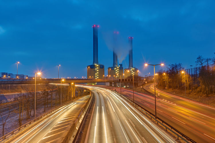 Power station and highway at night seen in berlin, germany