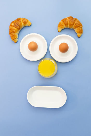 High angle view of breakfast on table against blue background