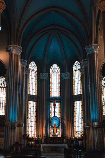 Low angle view of stained glass window in building