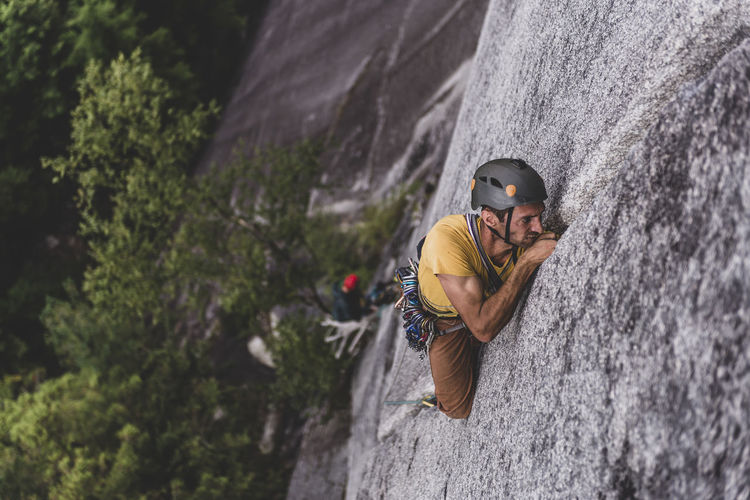 Man trad rock climbing lead on granite wide crack squamish canada