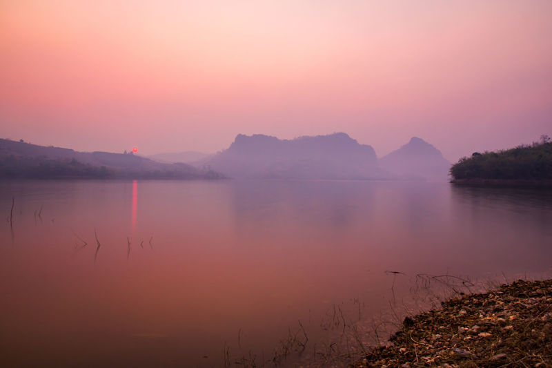 Scenic view of lake during sunset