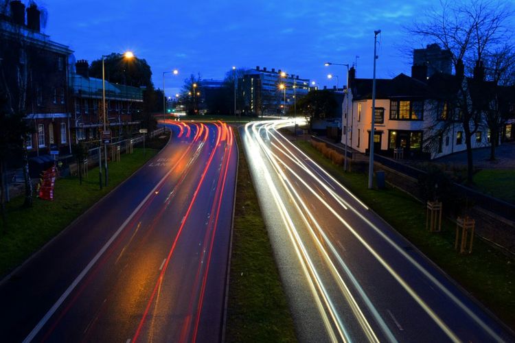 High angle view of light trails on streets at night
