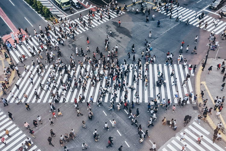 High angle view of people walking on city street in tokyo