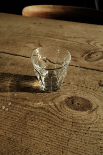 High angle view of drinking glass on table