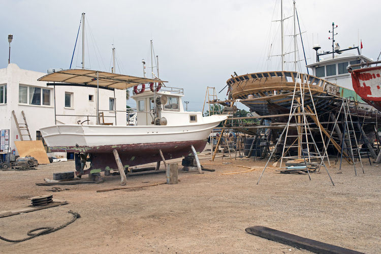 Fishing boats, wooden boats and ships on the lift in a shipyard in bodrum, turkey