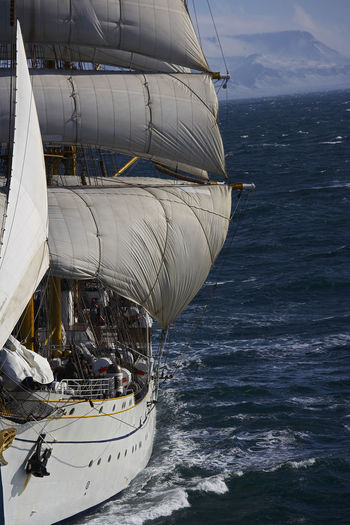 Barque under full sails in bad weather in iceland