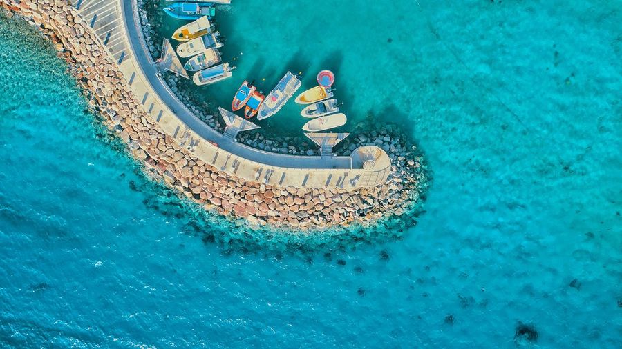 Aerial view of boats moored in sea
