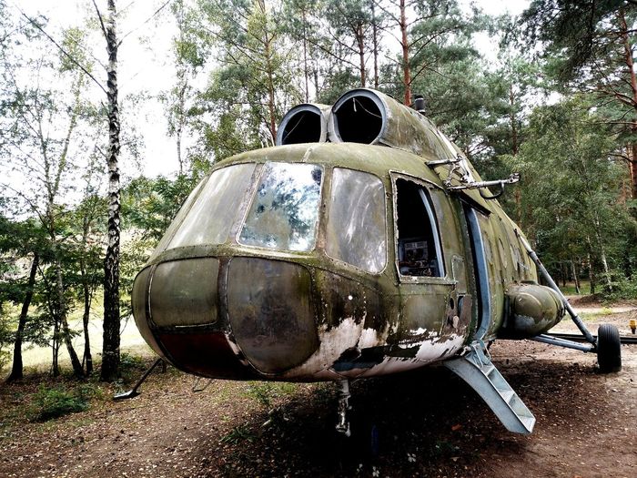 Abandoned vehicle in forest