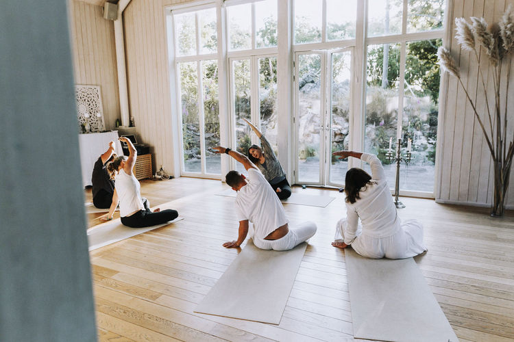 People practicing yoga in class