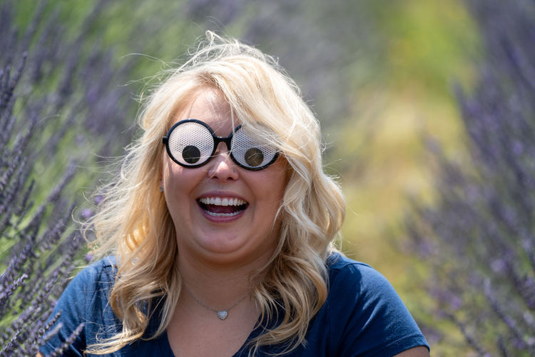 Smiling woman wearing novelty glasses
