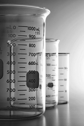 Measuring beakers on table in laboratory
