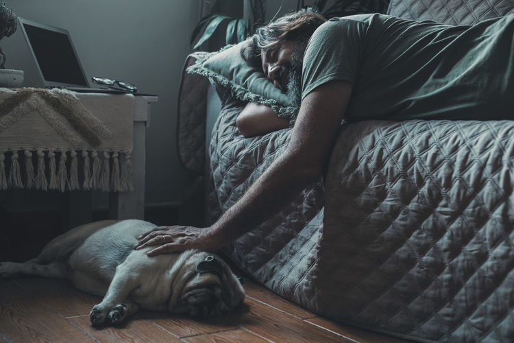 Woman sleeping on bed at home