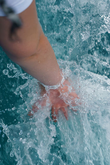 Midsection of woman in swimming pool