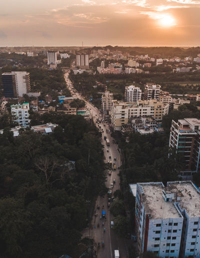 High angle view of buildings against sky at sunset