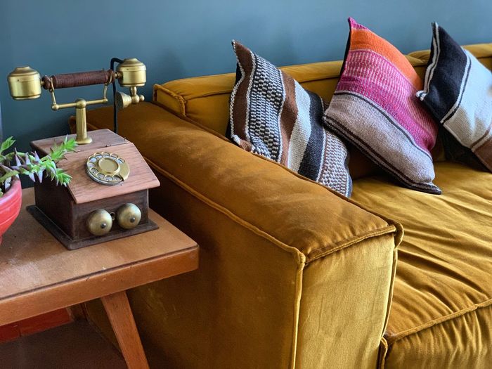 High angle view of pillows on sofa at home