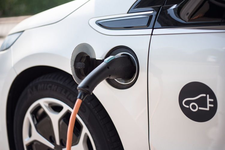 Close-up of electric car being charged