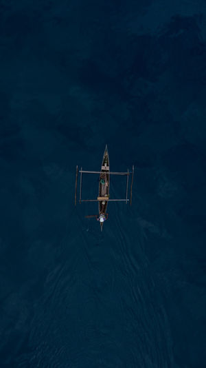 Aerial view of outrigger in sea