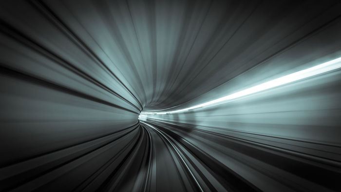 Blurred image of illuminated tunnel