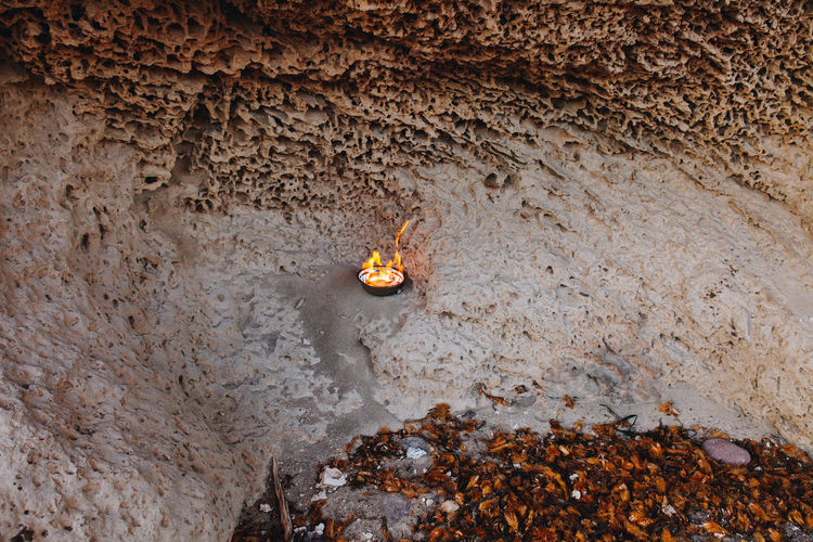Flame in a fire bowl on a beach