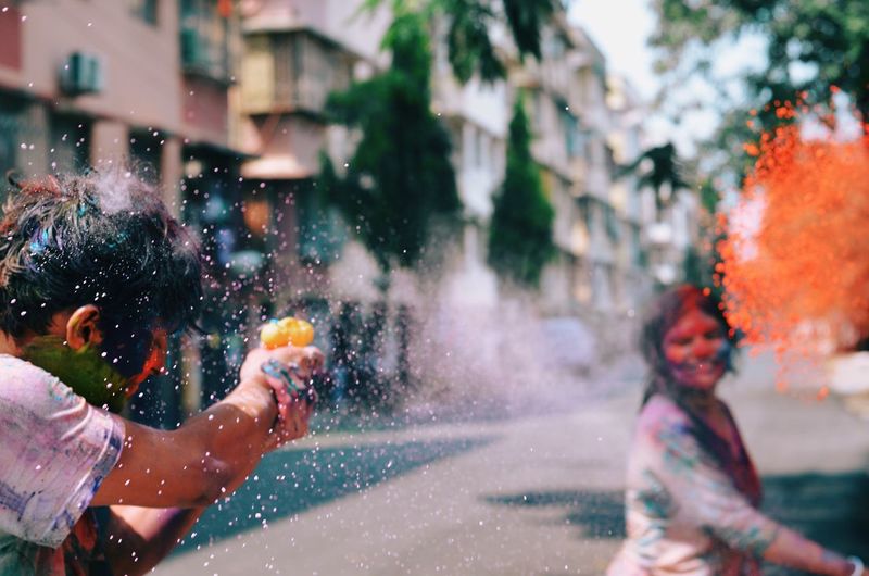 People throwing powder paint