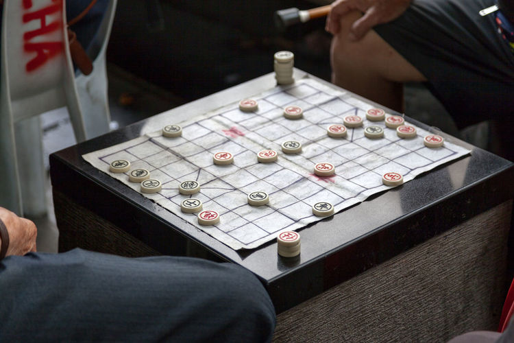 Two old chinese man playing xiangqi, also known as chinese chess or elephant chess.