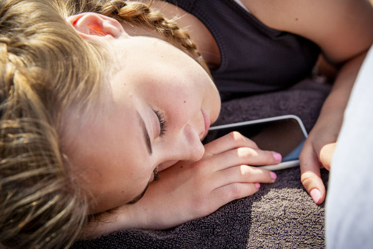 Girl sleeping with smart phone
