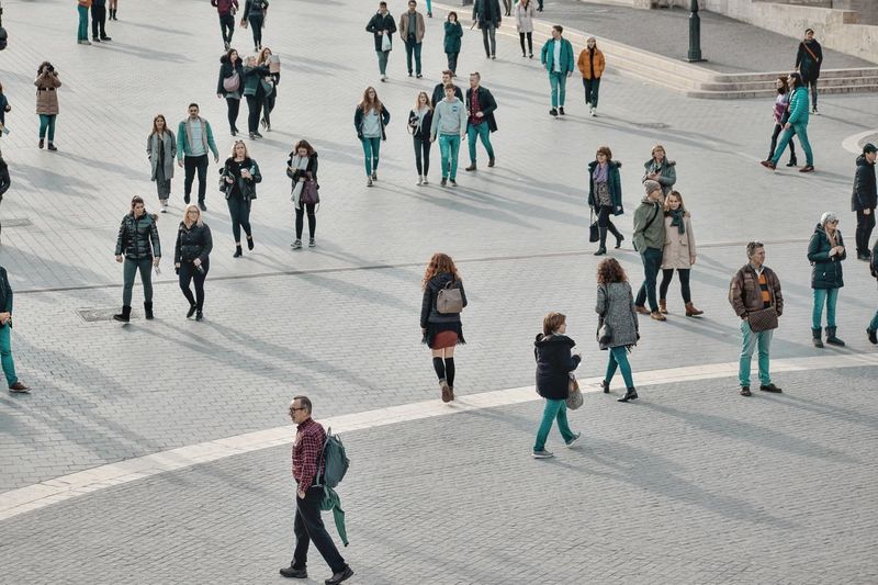 High angle view of people walking on street in city