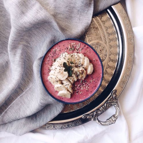 Directly above shot of chia seeds on banana slice in bowl