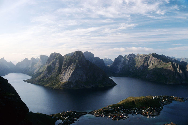 Scenic view of lake and mountains against sky